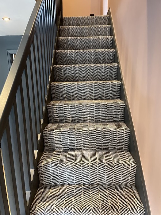 Stair runner with a bordered edge
